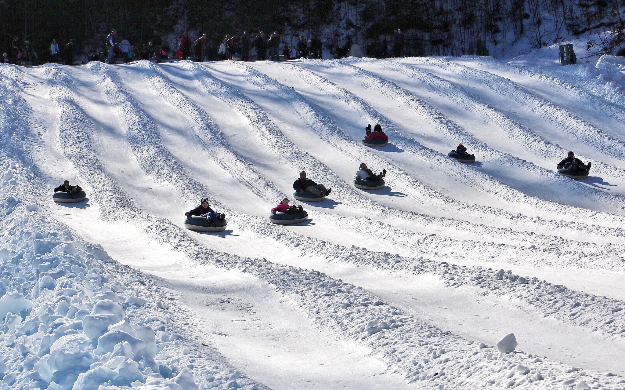 Tube World Maggie Valley NC Tubing slopes with people snow tubing down. Taken from the bottom