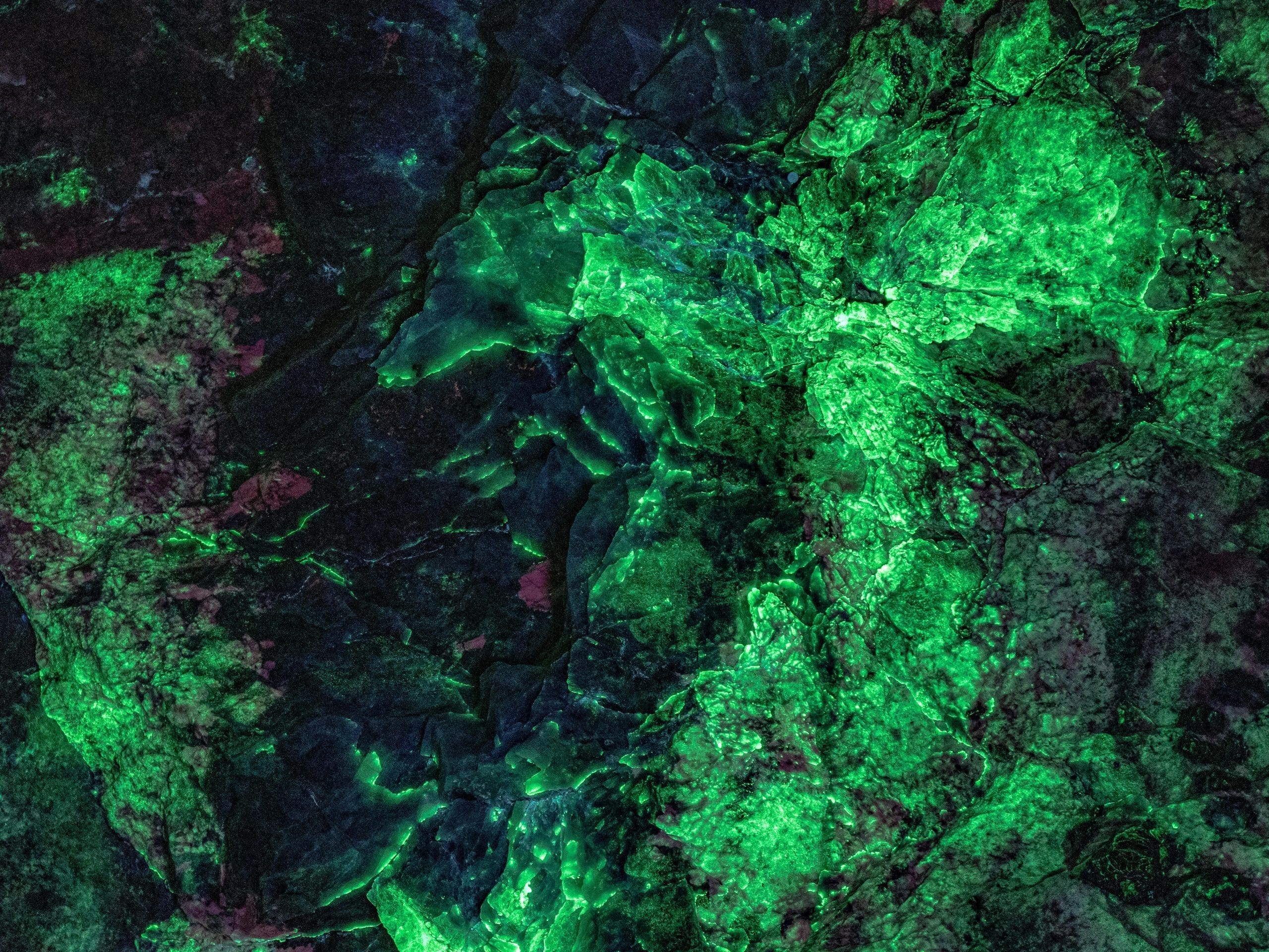 Emerald Village NC Black Light Tour Hyalite Opal at Emerald Village NC Black Light Tour glowing green under black light