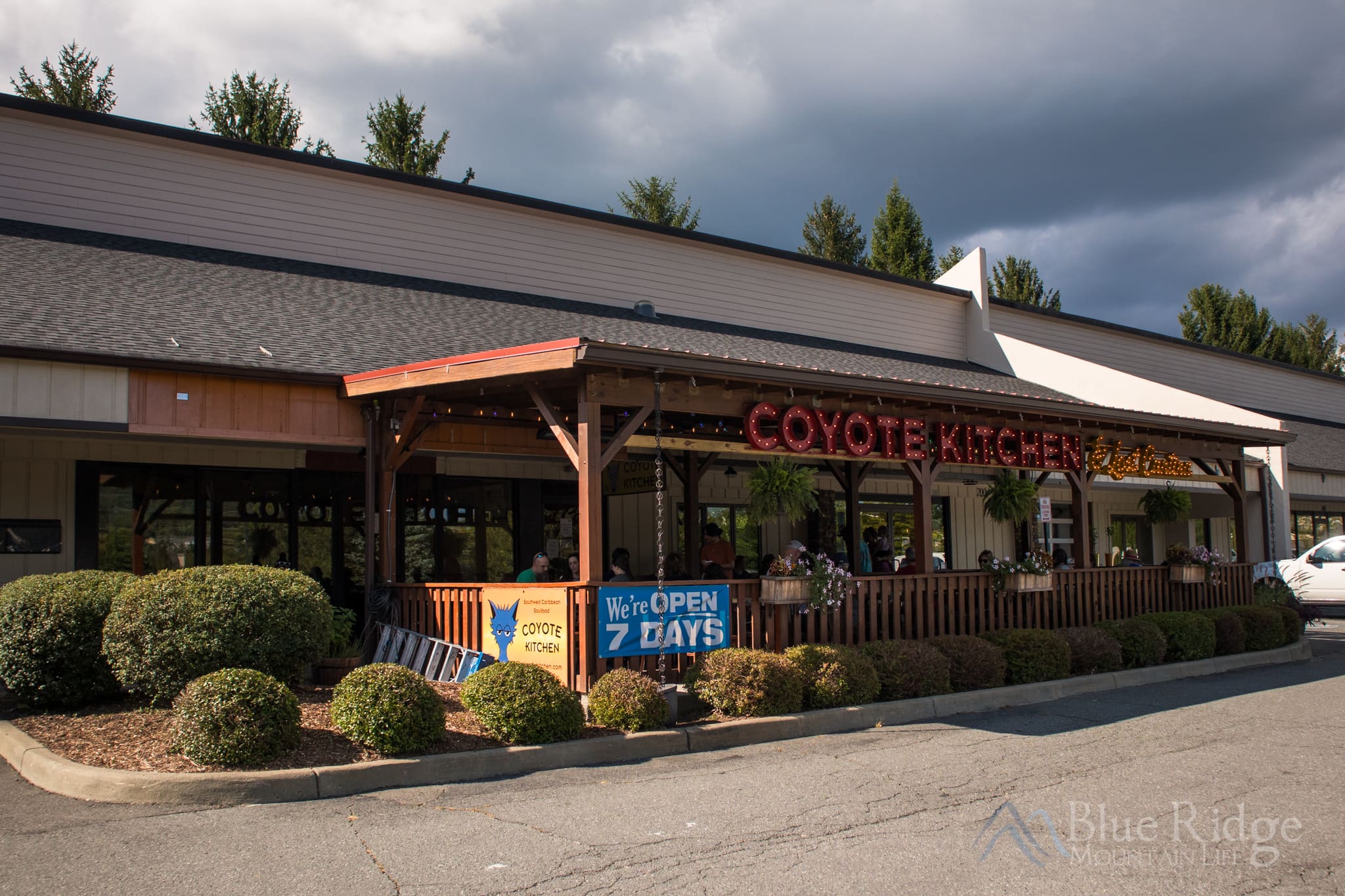 Coyote Kitchen in Boone NC Exterior photo of the Coyote Kitchen in Boone NC, showing the covered outdoor seating area.