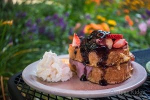Stuffed French Toast at Melanie's with beautiful purple flowers in the background.