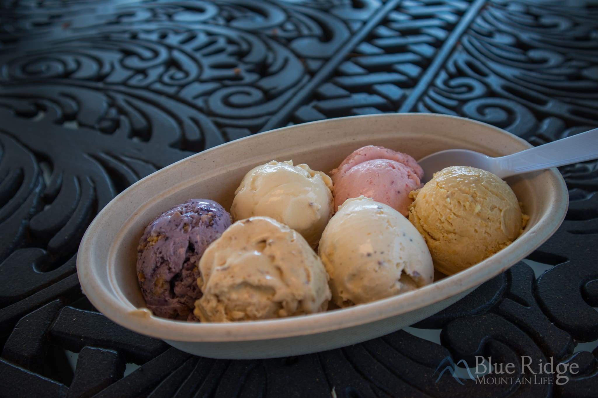 Hendersonville NC Ice Cream Trail Photo of large oval bowl of ice cream, with 6 different scoops of ice cream as a sampler of the Ice Cream Trail