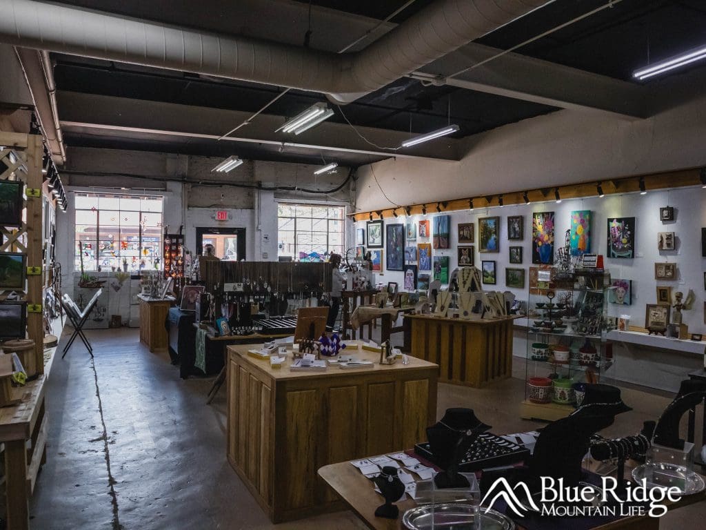 Interior photo of Arrowhead Art Gallery Old Fort NC showing the various art items for sale.