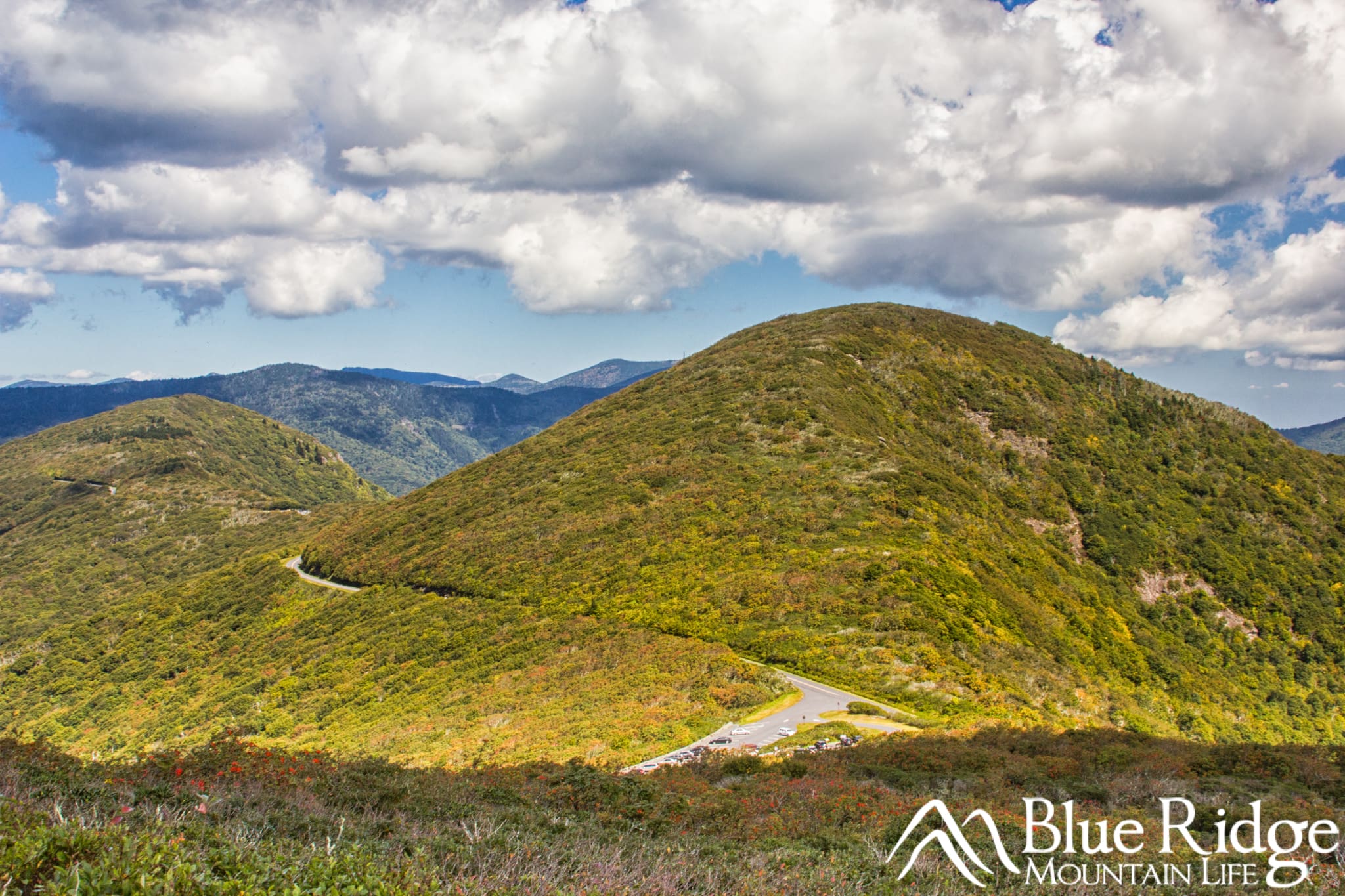 Craggy Gardens Pinnacle Trail Blue Ridge Parkway Craggy Gardens Pinnacle Trail Blue Ridge Parkway - Photo shows views of the surrounding mountains from the top of the trail with the parkway winding it's way around the nearby mountains.