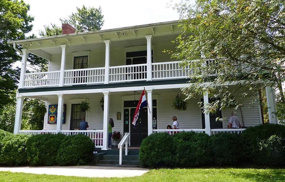 Shelton House Waynesville, NC Shelton House Waynesville, NC photo showing old white two story home, with a porch on both levels.