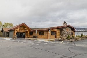 Exterior photo of the Red Fox Restaurant Waynesville, NC showing the rustic wood exterior that resembles a mountain cabin.