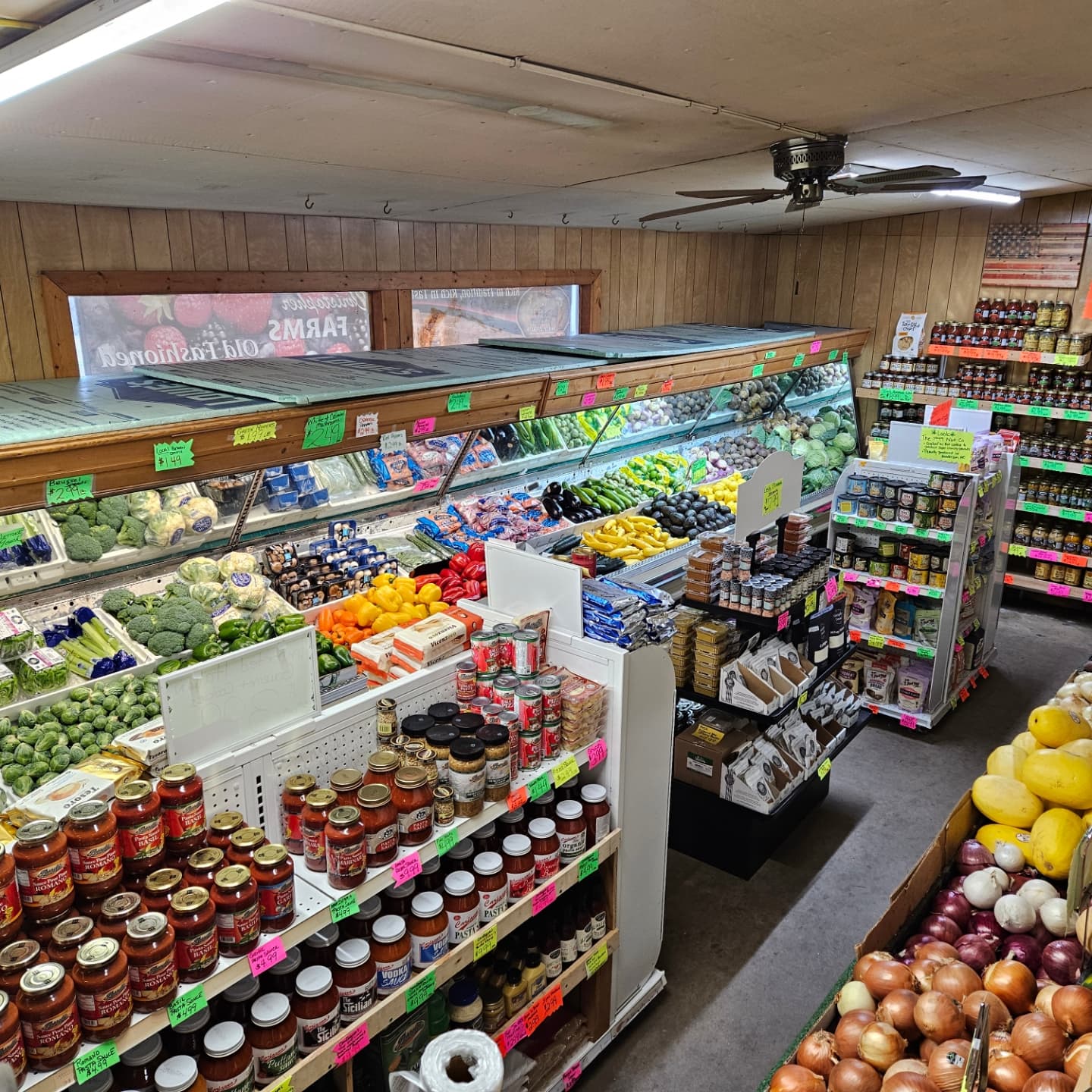 Christopher Farms Waynesville NC Interior photo of the Christopher Farms store in Waynesville. Photo shows an above view of the produce section, full of local goods, and vegatables on shelves